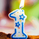 A lit birthday candle shaped like the number 1